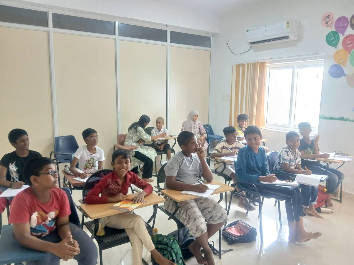 A full classroom of students at their desks during an English class at Thrive Academy.