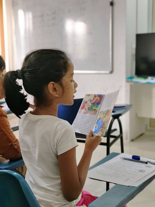 Students doing a story-writing activity.